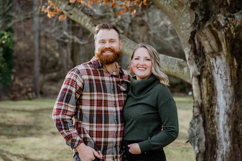 meet paige- a man and woman in front of tree in fall