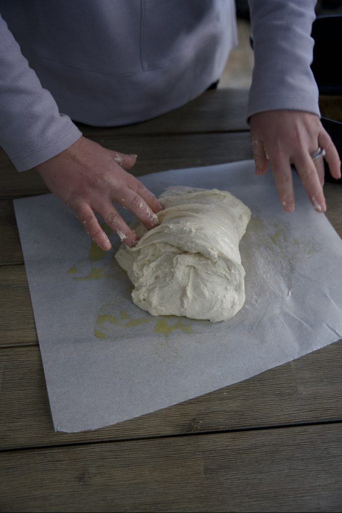woman doing envelope fold for sourdough