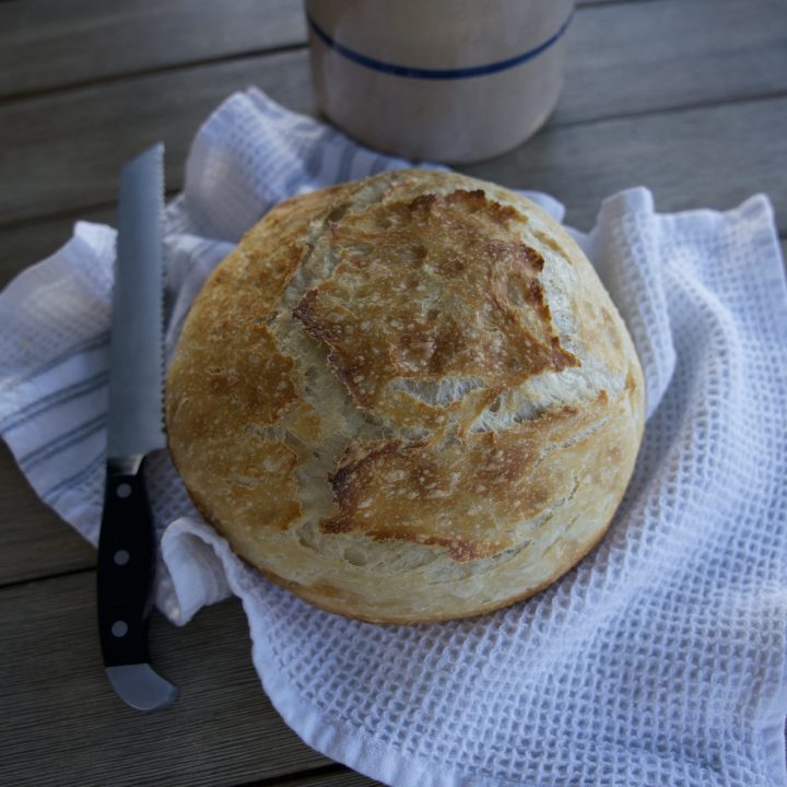 Finished sourdough bread on white tea towel
