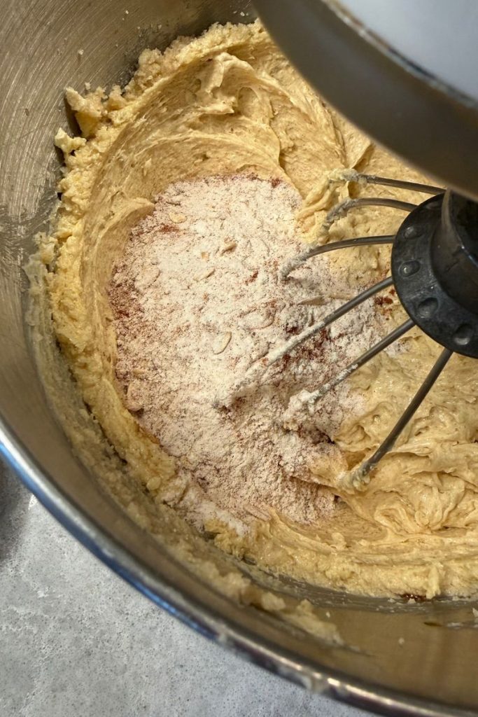 wet ingredients for oatmeal chocolate chip cookie dough with dry ingredients added in kitchen aid mixer